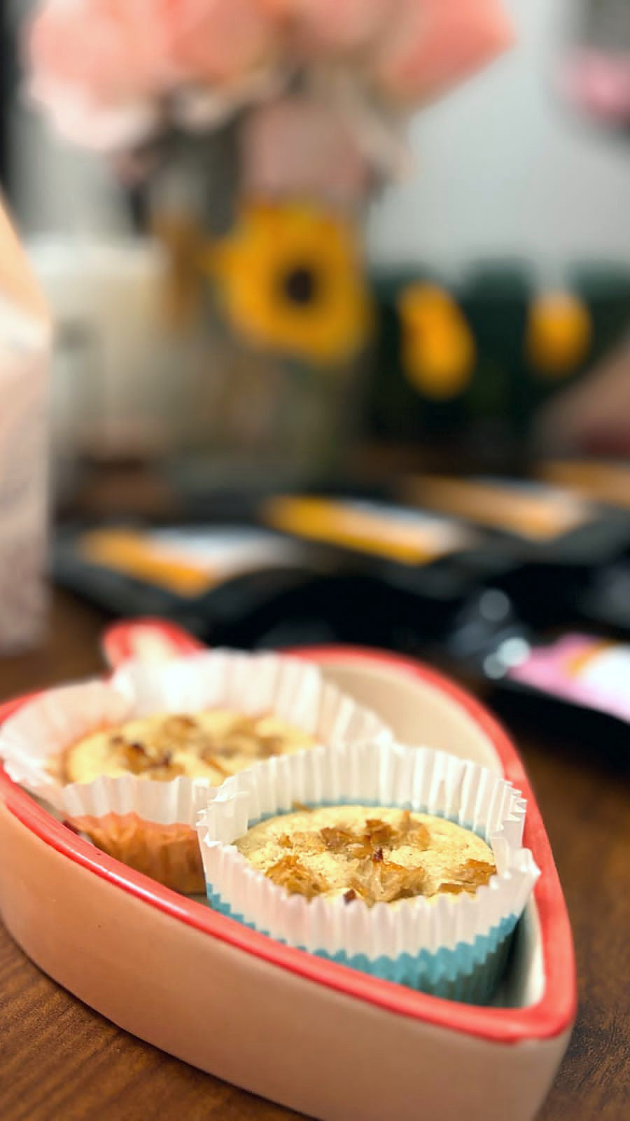 Two cupcakes in a heart-shaped dish