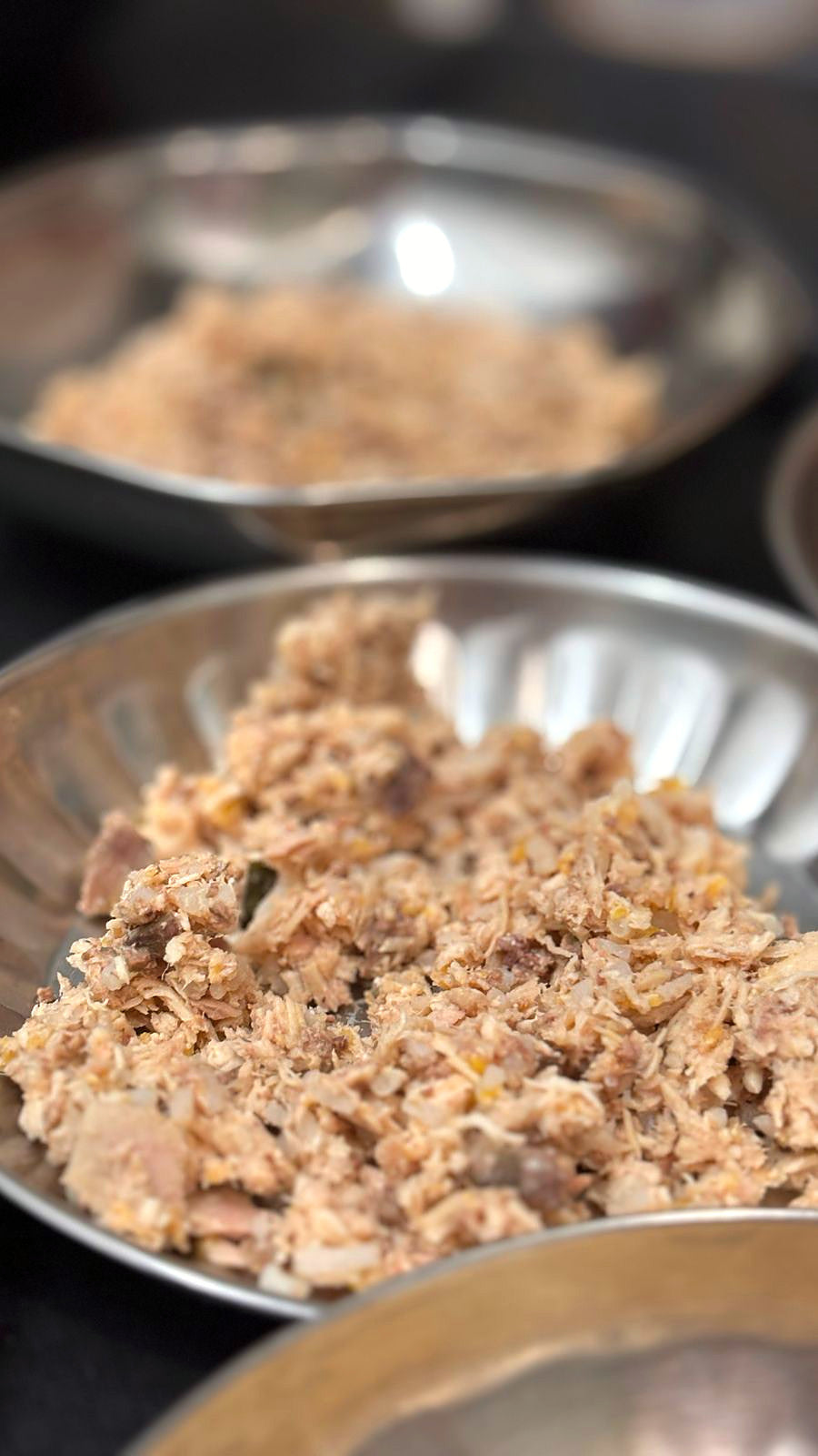 A freshly cooked meal in steel bowls